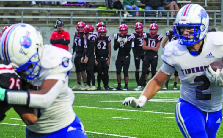 Sentinel Photo/Mike Reddell Tidehaven’s Jachen Duran (2) follows a block from running back Joseph Dodds (5) against Brazos defenders, as the Tigers take the regional playoff title at Rosharon’s Freedom Field last Friday.