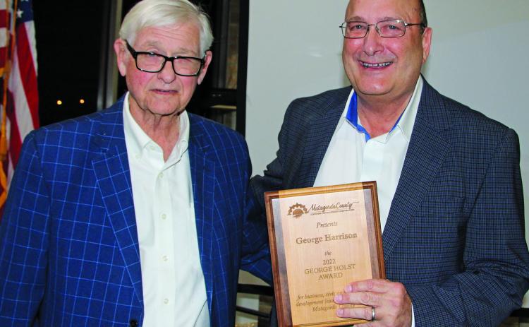 Photo by Mike Reddell Bill Cornman presents George Holst Award to George Harrison