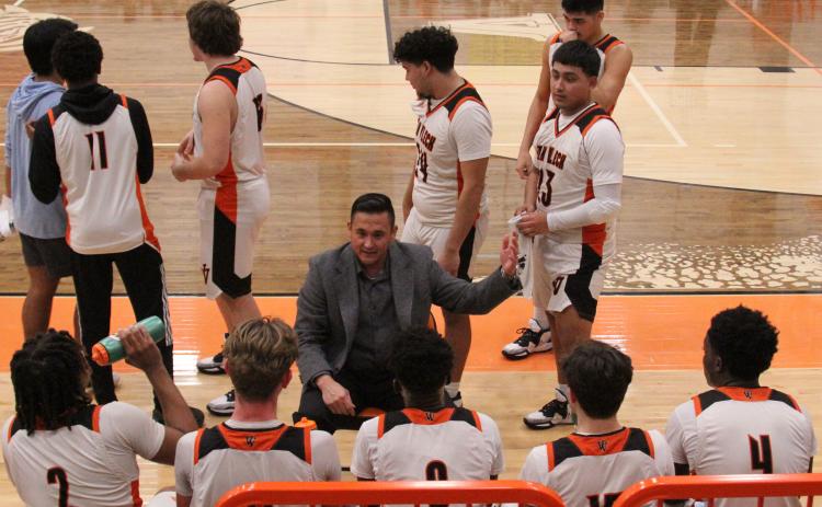 Photo by Anna Hernandez Leopard Head Basketball Coach Billy Ramey talks to his squad in last week’s 52-42 win over Brazos, Friday, Jan. 20. The Leopards are 11-8, 6-1 and second in District 24-3A-2.