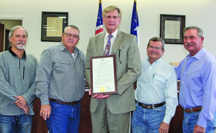 Sentinel Photo/Mike Reddell Matagorda County Commissioners Court approved resolutions that honored outgoing County Judge Nate McDonald and Precinct 2 Commissioner Kent Pollard at the court’s meeting Friday, Dec. 30. Above left, McDonald, center, holds his framed resolution, with commissioners, from left: Bubba Cook, Bubba Frick, Kent Pollard and Troy Shimek.