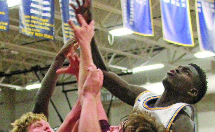Photo by Anna Hernandez A Blackcat reaches higher than Columbia defenders in this recent game. Bay City won 55-47 over Columbia. Bay City stands 6-17, 2-6 on the season.