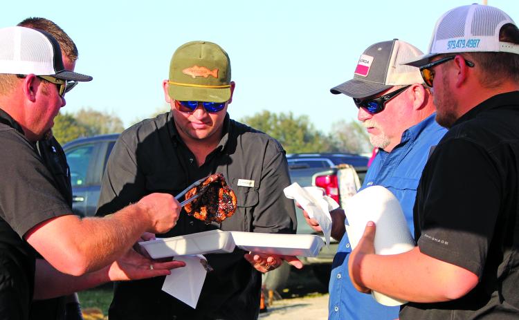 Sentinel file photo A cook-off team examines its steak entry.