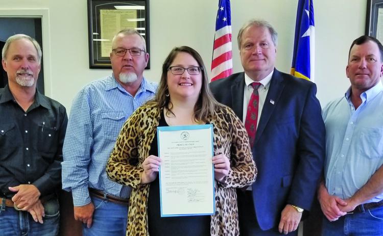 Sentinel Photo/Mike Reddell Commissioners Court approved a proclamation recognizing April 23 - 29, as National Library Week at the court’s meeting Monday, April 17. Shown are, from left: Precinct 1 Commissioner Bubba Cook, Precinct 4 Commissioner Bubba Frick, Bay City Library Director Samantha Denbow, County Judge Bobby Seiferman, and Precinct 2 Commissioner Mike Estlinbaum.