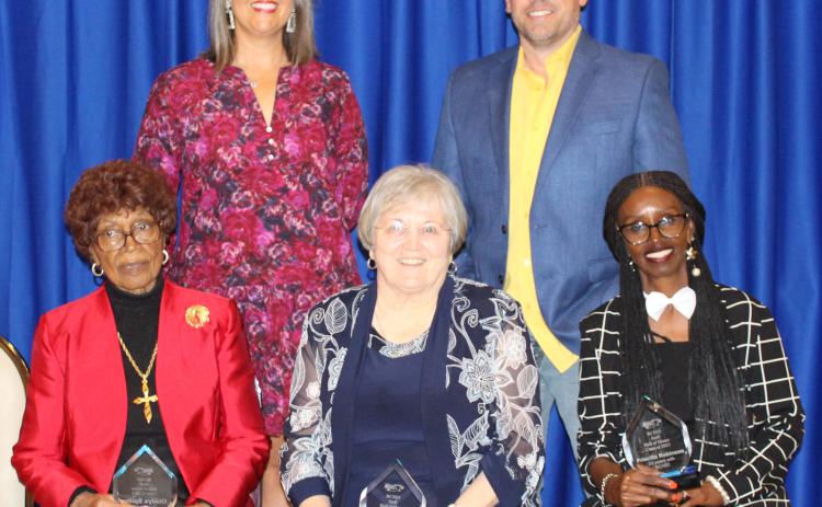 Sentinel Photo/Jessica Shepard Gladys Beller Spiller, the late Otha D. Gray, Jr., and Priscilla Robinson were honored for their commitment to Bay City ISD and their service as educators at BCISD's annual Employee Appreciation Banquet last Thursday. Gray was represented by his wife Jeanne, center, for the award, with Bay City ISD Trustee President Jill Westmoreland and Trustee Trent Tinnin, back.