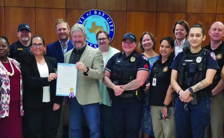 Sentinel Photo/Mike Reddell City Council recognized National Police Week (May 14-20) with a proclamation and a photo with Bay City Police at council’s May 9 meeting.