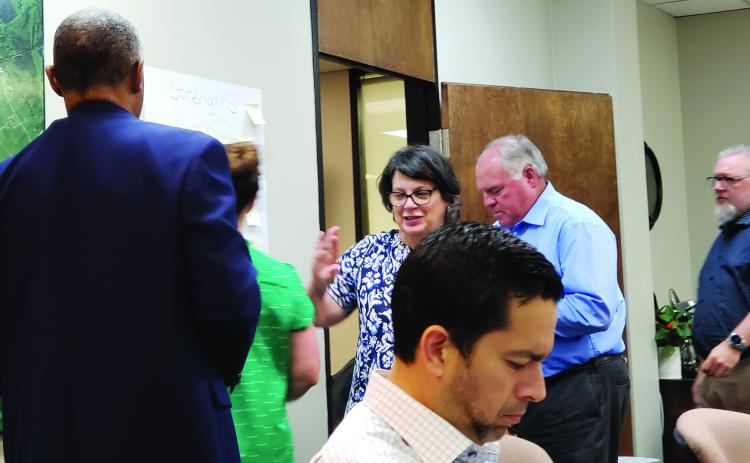 Sentinel Photo/Jessica Shepard Bay City Community Development Corporation board members participated in a strategic planning workshop Monday afternoon. The board reviewed and named the possible strengths, weaknesses, opportunities, and threats that face economic development and the city itself.