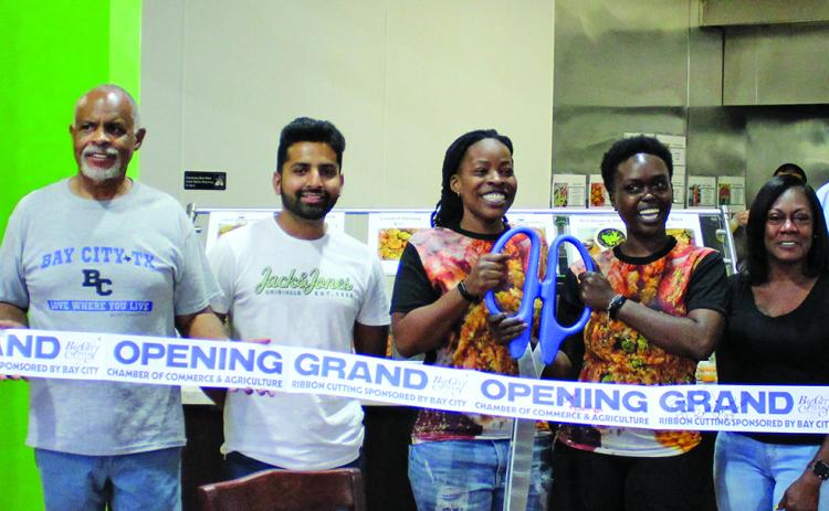 Sentinel Photo/Jessica Shepard Cajun Wok partnered with the Bay City Chamber of Commerce & Agriculture to celebrate its grand opening with a ribbon-cutting ceremony Friday, June 2. The restaurant is located at 4117 Avenue F inside Maverick Market in Bay City.