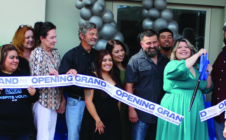 Sentinel Photo/Jessica Shepard Infinite Fades had its grand opening ribbon-cutting ceremony Monday, June 5. Family and friends joined Infinite Fades owner Crystal Charles for the ceremony. The cut and style barbershopshop is located at 1621 6th St., Unit B in Bay City.