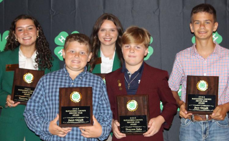 Sentinel Photo/Jessica Shepard Bronze, Silver, and Gold Star awards were presented to outstanding 4-H club members in their given divisions during the annual 4-H banquet Thursday, July 20. Those recipients are: back row from left: Victoria Sliva and Ansley Kubecka; front row, from left, Jeret Girndt, Drayson Saha and Jace Girndt. Kacey Kubecka is not pictured. See Page 8 for more 4-H award winners.
