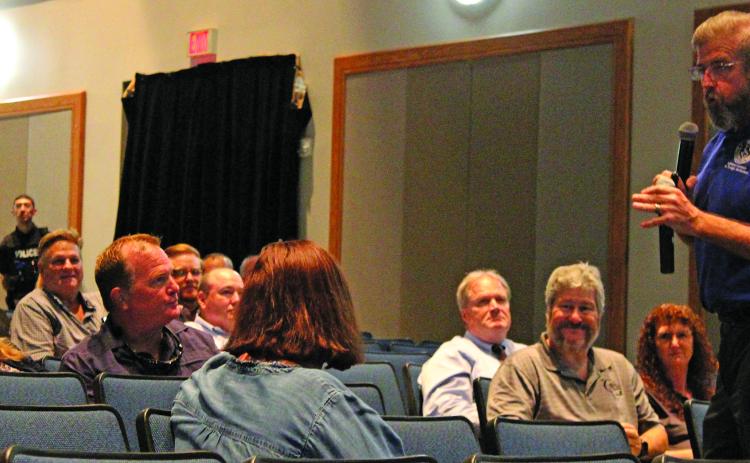 Sentinel Photo/Jessica Shepard Bay City ISD Superintendent Dr. Dwight McHazlett, right,  spoke to over 30 audience members about the district’s desire for more community partnerships and how the district was meeting its LSG goals last Thursday.