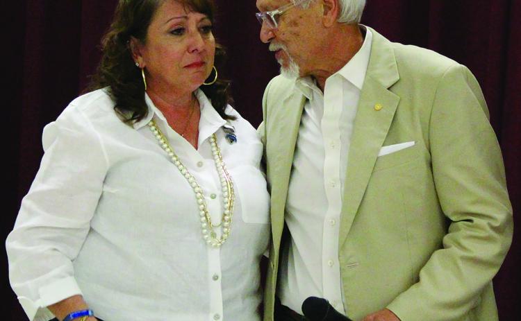 Sentinel Photo/Jessica Shepard Cynthia “Cindy” Delgado is shown with District Attorney Steven Reis as the 100 Club presented the widow of BCPD officer Juan Delgado with a $20,000 check from the club.