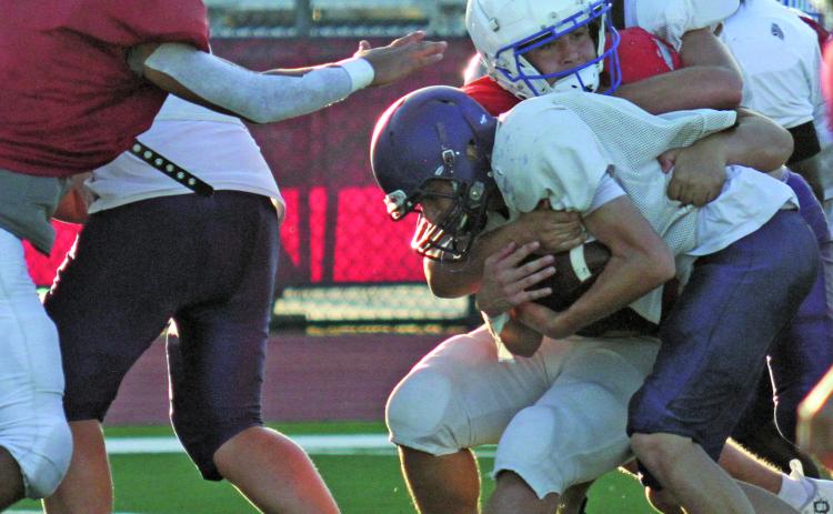Anna Hernandez photo Tidehaven defenders make a stop on a Shiner running play at last Friday’s scrimmage.