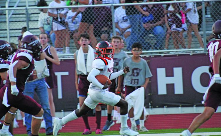 Anna Hernandez photo A Van Vleck runner stays ahead of Ganado defenders.