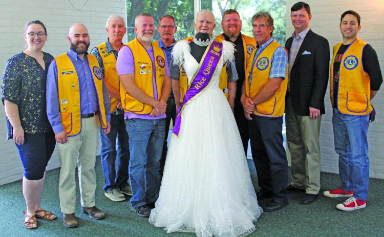Sentinel Photo/Jessica Shepard Bay City Lions Club members pose with this year’s Rice Festival Queen dress, sponsored by OQ Chemicals on Sept. 8. From left are Pageant Director Rachel Ricks, Pageant Chairman Ryan Ricks, Mike Finster, Chris Hadash, Dan Shook, Doc Campbell, Chad Craft, David Krenek, Eric Wright from OQ and Ben Flores. The dress and crown are from "New Beginnings" in El Campo and also feature jewelry from Green Bros. Jewelers.