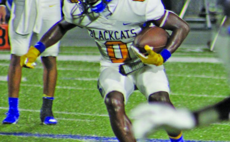 Sentinel Photo/Mike Reddell Bay City junior running back Jada Andrews (0) looks for an opening against Edna last Friday.