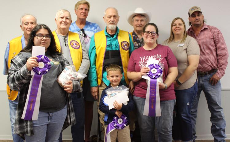 Winners of the annual Rice Dish Round-up contest were awarded blue ribbons on Tuesday, Oct. 17. Grand Champions, above, received purple ribbons along with a cash award and bag of rice. From front left are Angeleigh Gonzales, grades 9-12; George McHugh, grades 1-5; and Ashley Brewer, adult division. Not pictured is Jace Grindt, grades 6-8.