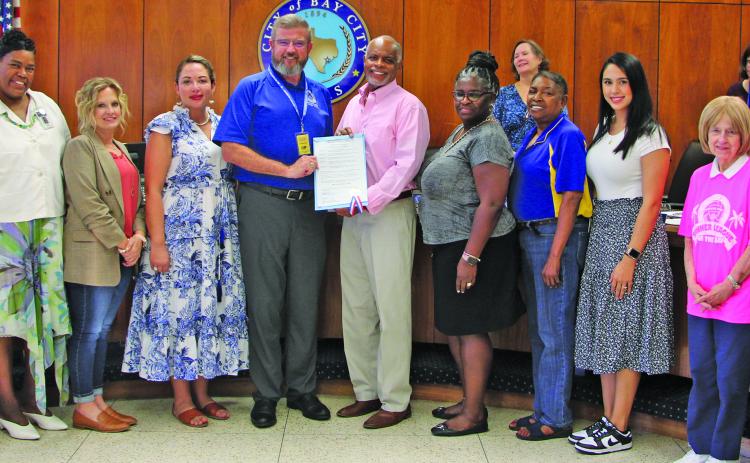 Sentinel Photo/Mike Reddell City Council last week approved a proclamation recognizing October 5, 2023, as "Bay City Teachers' Day." At the center of photo, Bay City ISD Superintendent Dwight McHazlett (left) and Mayor Robert Nelson show off the proclamation.