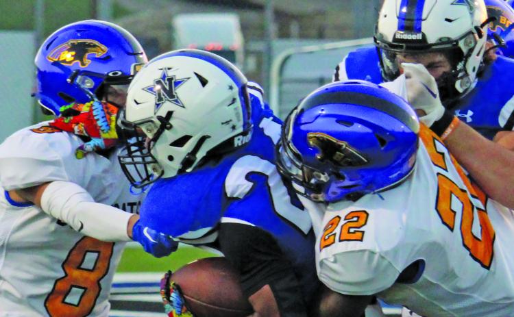 Sentinel Photo/Mike Reddell Senior defensive back Elijah Hernandez (8) and sophomore linebacker James Copeland (22) put a stop to a Navasota running back.