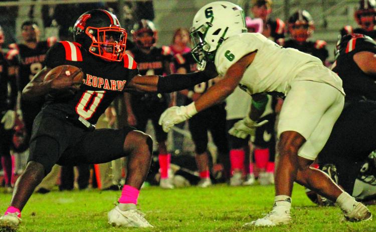 Anna Hernandez Junior Van Vleck running back Corey Austin (0) tries to move past a Boling defender. Austin had a 39-yard touchdown run.