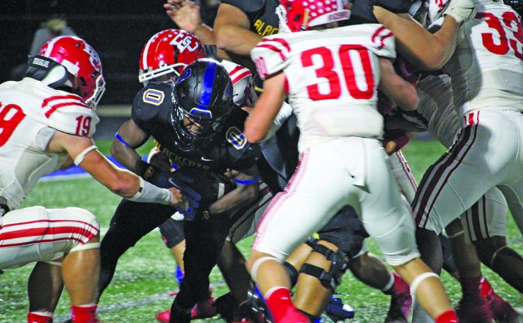 Sentinel Photo/Mike Reddell Junior running back Jada Andrews (0) barrels through the middle of El Campo defenders for yardage. Andrews had a game-high 161 yards rushing.