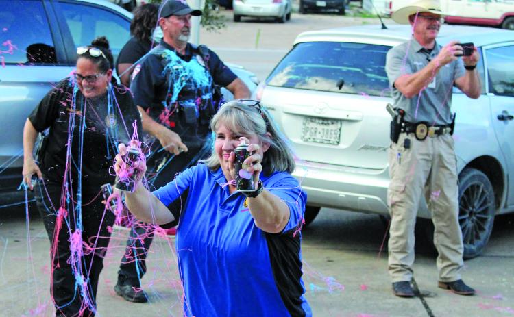 Sentinel photo/Jessica Shepard Bay City Police Department personnel faced off against each other and neighborhood children during Bay City Public Library's annual "National Night Out" kick-off Oct. 10. National Night Out is an annual community-building campaign that promotes police-community partnerships and neighborhood camaraderie.