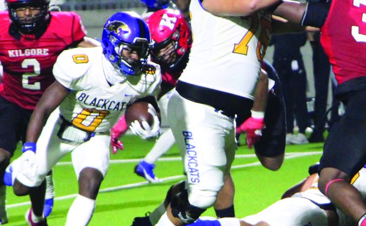 Sentinel Photo/Mike Reddell Junior running back Jada Andrews (8) follows senior guard Marco Mata (76) to gain yards.