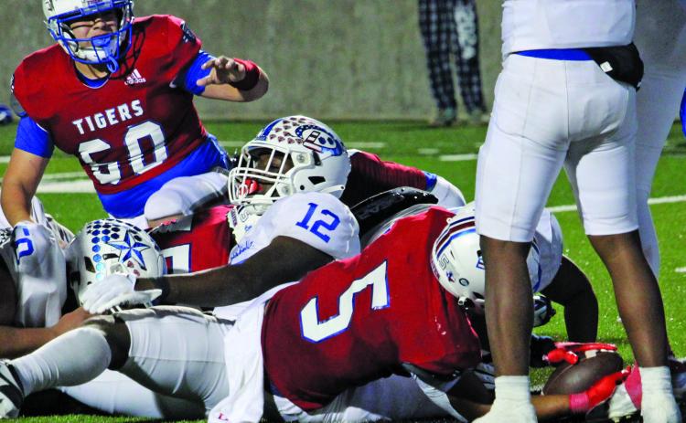 Sentinel Photo/Mike Reddell Tigers’ Joseph Dodds (5) puts the ball across goal line for the winning score.