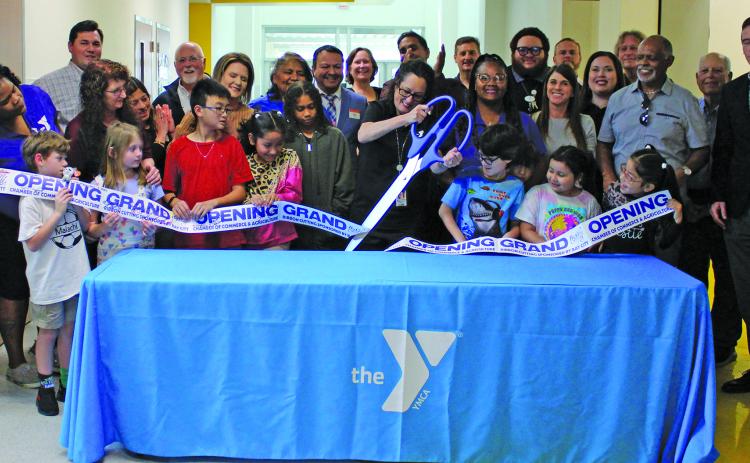 Sentinel Photo/Jessica Shepard The Bay City YMCA Program Center partnered with the Bay City Chamber of Commerce & Agriculture to celebrate its grand opening with a ribbon-cutting ceremony, on March 11. Bay City YMCA currently has an after-school program located on Tenie Holmes, Linnie Roberts, and Cherry Elementary campuses.