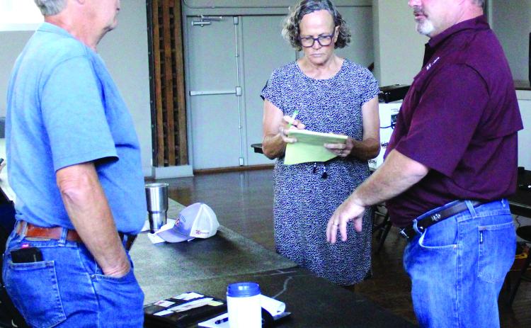 Sentinel Photo/Jessica Shepard Corpus Christi Texas A&M AgriLife Extension Livestock Specialist Dr. Karl Harborth, left, addresses concerned ranchers at the Matagorda County Soil & Water Conservation District’s (SWCD) workshop on June 7.