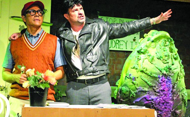 Sentinel Photo/Jessica Shepard Seymour Krelborn (Ray Garcia) left, gets visibly uncomfortable listening to Dr. Orin Scrivello, DDS (Todd Bonny), right, trying to persuade him into a new partnership for more fame and notoriety of his Audrey 2 plant during CAST's press night Aug 1. That scene is one of many in the comedic musical "Little Shop of Horrors" being showcased this week Thursday-Saturday, Aug. 8-10.