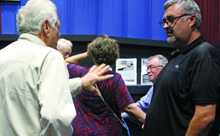 Sentinel Photo/Jessica Shepard Lynn Engineering owner Stuart Lynn, left, talks with an audience member after his luncheon presentation on Aug. 20. The lunch was sponsored by the Bay City Community Development Corporation and featured Lynn’s five tools for successful business growth as the topic.