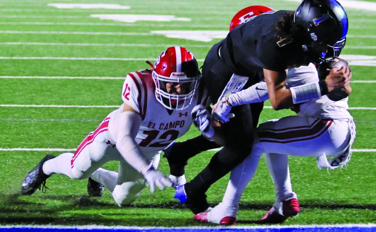 LeDarion Stone/Live in the Moment Photography Bay City’s senior quarterback Alex Estrada plunges ahead for a touchdown against El Campo Friday at Memorial Stadium.