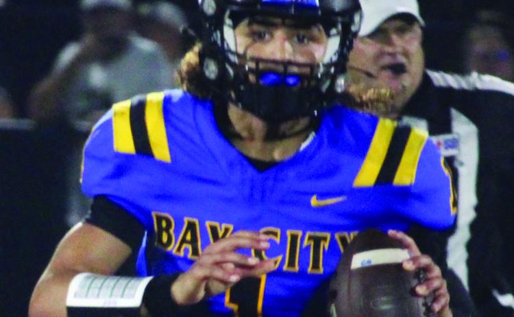 Sentinel Photo/Mike Reddell Blackcat senior quarterback Alex Estrada looks for a receiver, in his 351-yard passing night against Calhoun Friday.