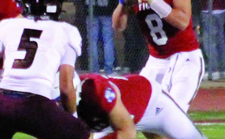 Sentinel Photo/Jessica Shepard Tiger quarterback Kale Russell (8) looks for a receiver.