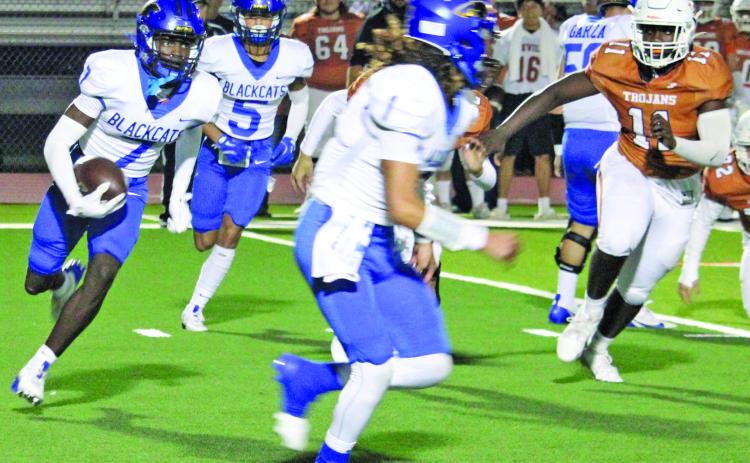 Sentinel Photo/Mike Reddell Blackcat senior wide receiver Xylan Williams (7) looks for blocking as senior quarterback Alex Estrada (1) leads the way against Beeville Friday night.
