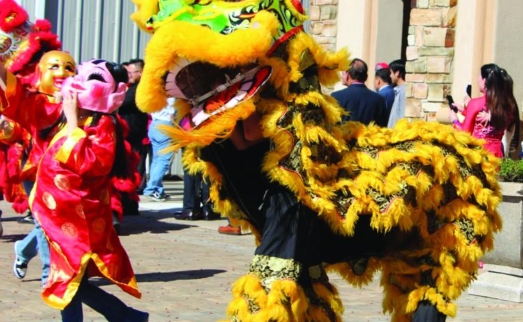 Sentinel Photo/Jessica Shepard Palacios residents celebrated Lunar New Year with a variety of traditional fanfare on Saturday, Feb. 1. The dragon and lion dancers above symbolically drove away bad luck from the previous year and ushered in goodwill for 2025. See more photos from the celebration on Page 8.