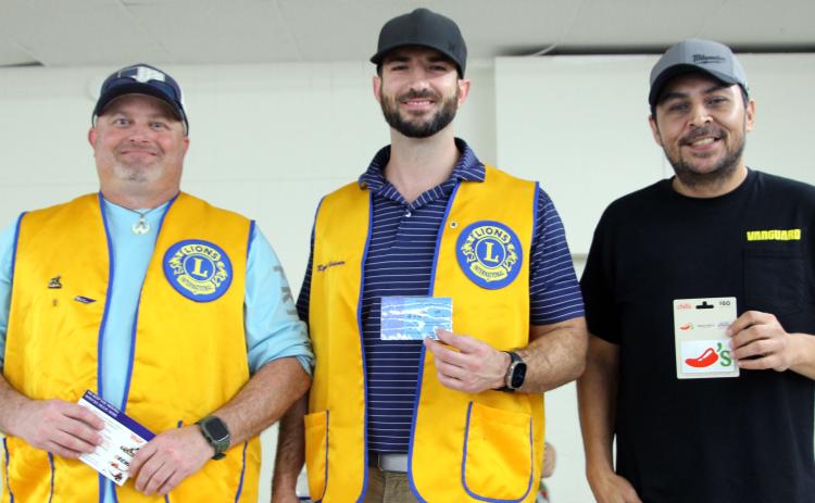 Sentinel Photo/Jessica Shepard : Several adults and teens raced to devour 10 pancakes at the Bay City Lions Club's annual "Pancake Supper" on Thursday, March 27. First through third-place honors went to, from left, John Miller, Ryan Leissner, and Benji Mata.