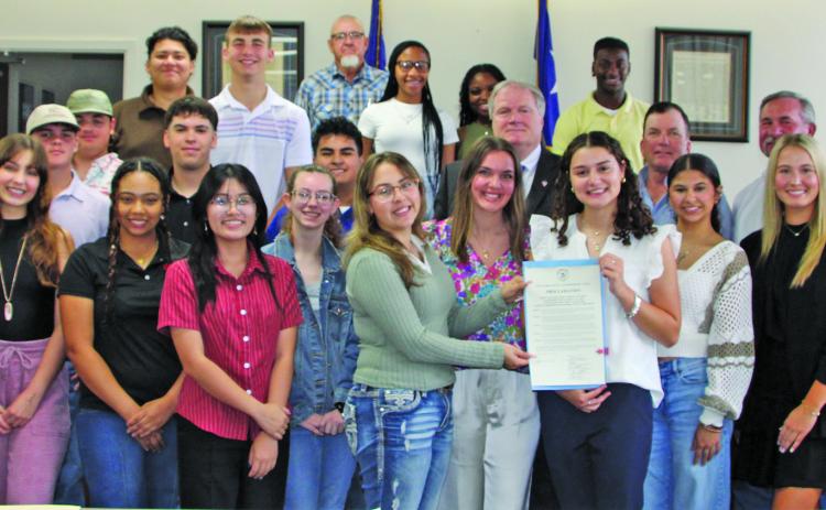 Sentinel Photo/Mike Reddell Commissioners Court proclaimed April 21-25 as National Student Leadership Week for the Youth Leadership Matagorda County Program participants, shown above with Commissioners Court members and sponsor James Outtrim, with HIF USA  Matagorda County.