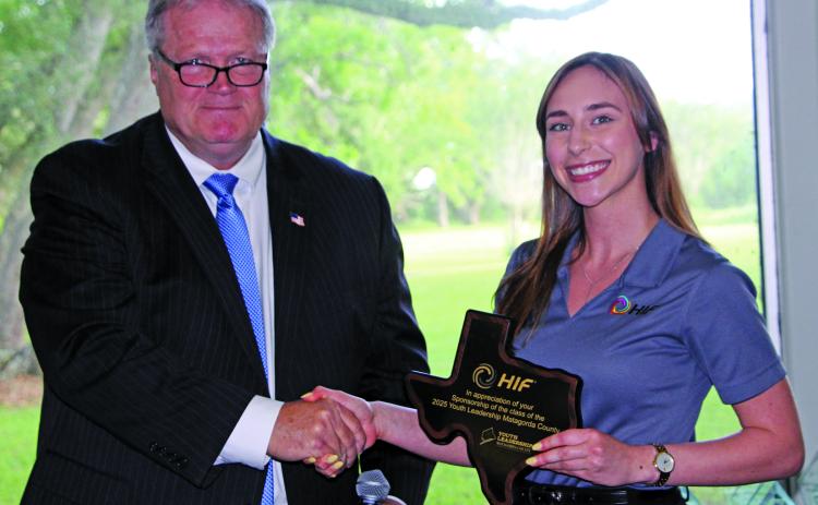 Sentinel Photo/Jessica Shepard County Judge Bobby Seiferman presented HIF USA Administrative Assistant Abigail Heisler with a recognition award at the Matagorda County Youth Leadership awards banquet on May 7. The award is for HIF USA’s continued program support for the second year in a row.