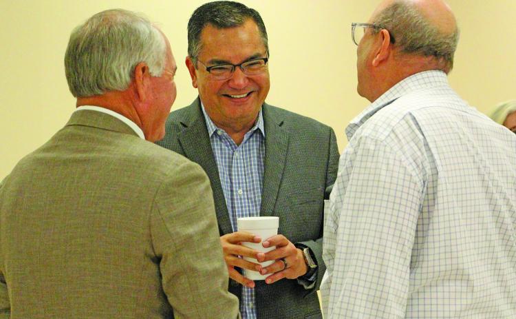 Sentinel Photo/Jessica Shepard Chuck Kharrl (center) laughs with Mitch Thames, left, and George Harrison.