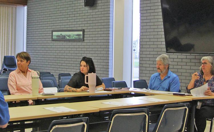 Sentinel Photo/Jessica Shepard City Engineering Technician Gabriel Lopez, right, presents a reimbursement request for a Cottonwood Park topographical survey at TIRZ #1 board meeting on Thursday, Aug. 21.