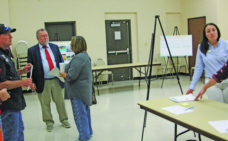 Sentinel Photo/Jessica Shepard Halff Senior Resilience Planner Melissa Beaudry, far right, talks with Bay City Community Development Corporation Executive Director Jessica Russell, far left, and Precinct 2 Commissioner Mike Estlinbaum.