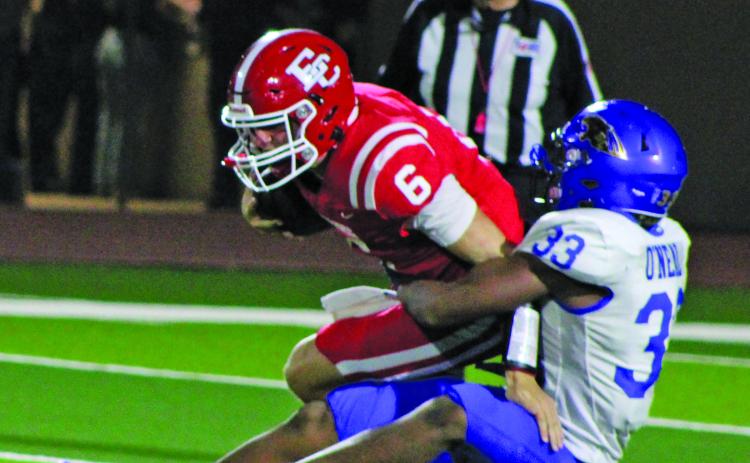Sentinel Photo/Mike Reddell Senior defensive end Jordan Oneal (33) has a firm grasp of El Campo quarterback Colt Reeve (6) Friday night.