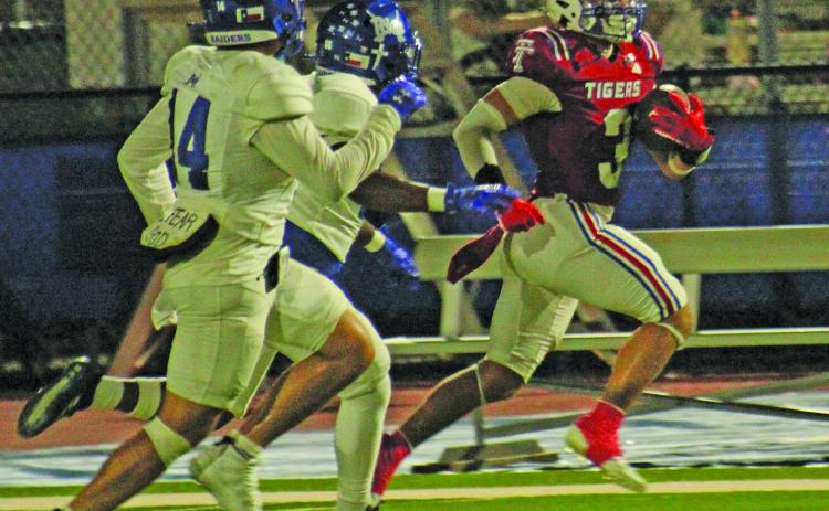Anna Hernandez photo Tidehaven senior wide receiver TJ Galvan (3) locks in a big gain for the Tigers against Rice last Friday.