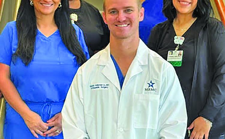 Contributed photo Dr. Randy Volkmer II and his staff at Medical Group clinic.