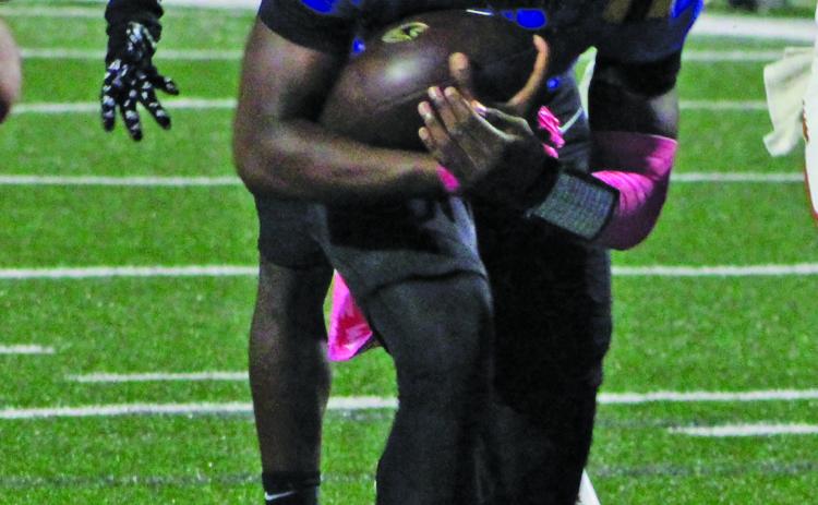 Sentinel Photo/Mike Reddell Bay City quarterback Keimarion Wiggins (2) barrels ahead for a Blackcat touchdown.