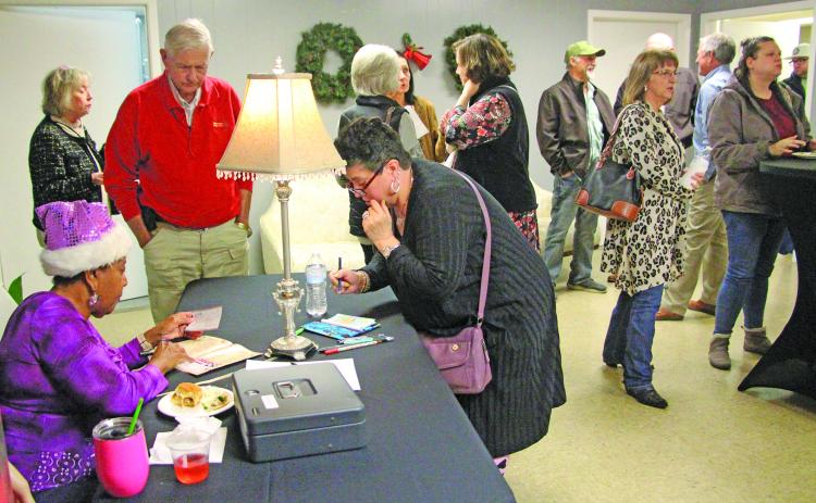 Sentinel Photo/Jessica Shepard New and returning Community Actors of South Texas (CAST) patrons sign up for the 2026 production season during CAST's 'Premiere Night' event Dec. 2.