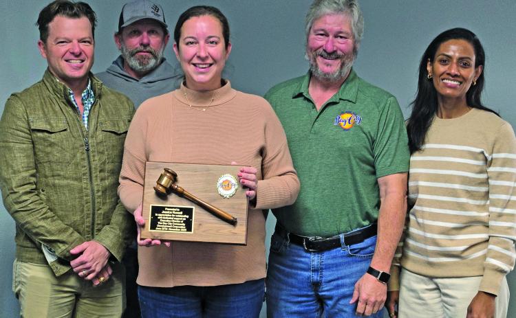 Sentinel Photo/Jessica Shepard Bay City Community Development Corporation presented a service award plaque to past BCCDC Executive Director Jessica Russell, center, on Friday, Jan. 16. Russell is joined by board members Bradley Westmoreland, Clint Hewitt, BCCDC Board President Jim Folse, BCCDC Board Vice President Erandi Allison.