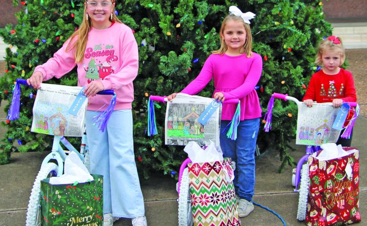 Sentinel Photo/Mike Reddell These three girls are the winners in the Bay City Sentinel’s Annual Christmas Coloring Contest. They are, from left: Hayden Jones, 9-12 age category; Kate Bartek, 5-8 category; and Brynn Mach, 2-4 category.