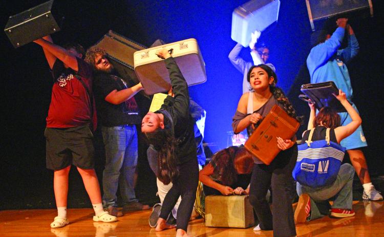 Sentinel Photo/Jessica Shepard During the "Anon(ymous)" opening sequence, BCHS Dungeoneers Madilynn Johnson and Sophie Jaramillo project the baggage of their respective characters on stage at the troupe's OAP rehearsal on March 25.